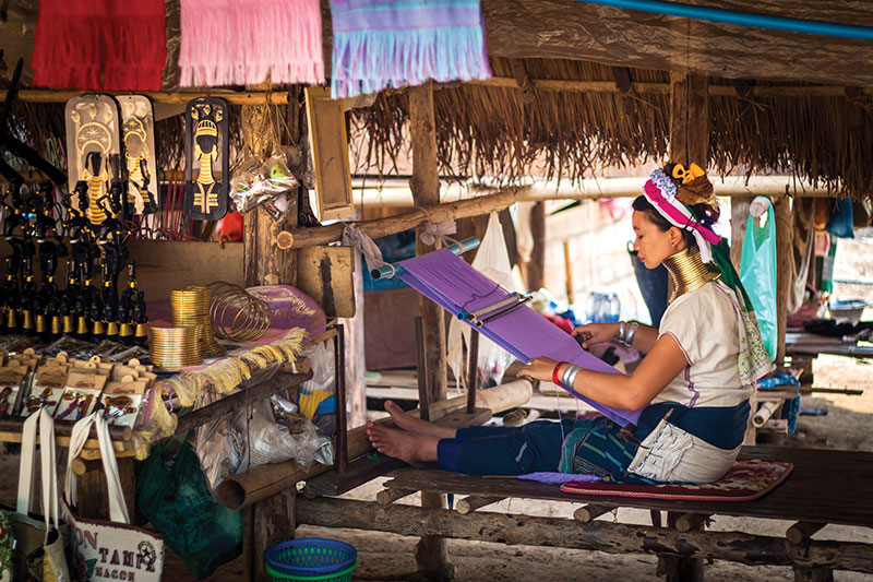 Tradition in motion—a Karen woman weaves intricate shawls in a Northern Thai village