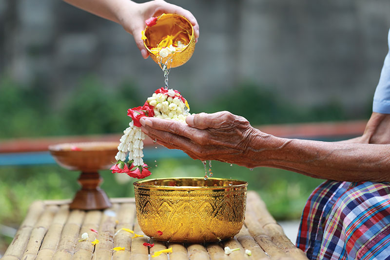 Water-blessing ceremony, where younger generations honour their elders