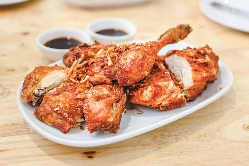 crispy fried chicken with shallots and a tangy sauce crispy fried chicken<br />
with shallots<br />
and a tangy sauce