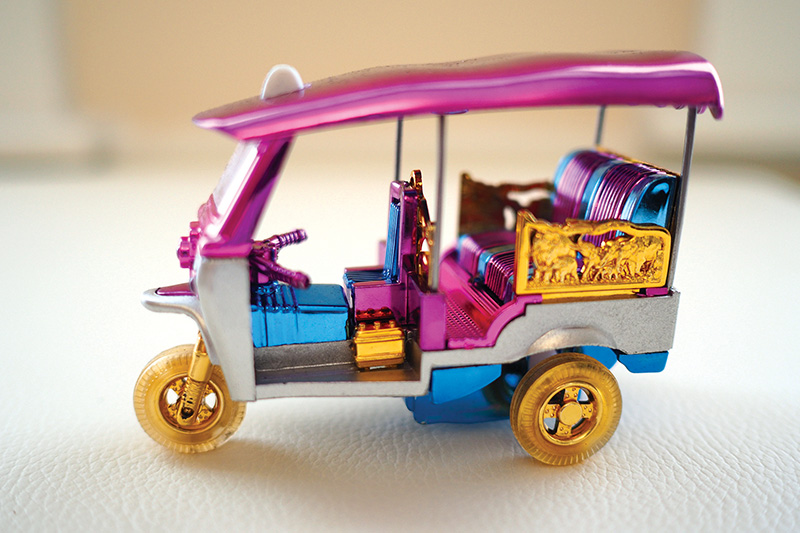 A charming miniature tuk-tuk that captures the spirit of Bangkok